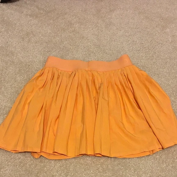 ALO Yoga Women's Aces Tennis Skirt in orange Canteloupe size XS - Picture 5 of 6